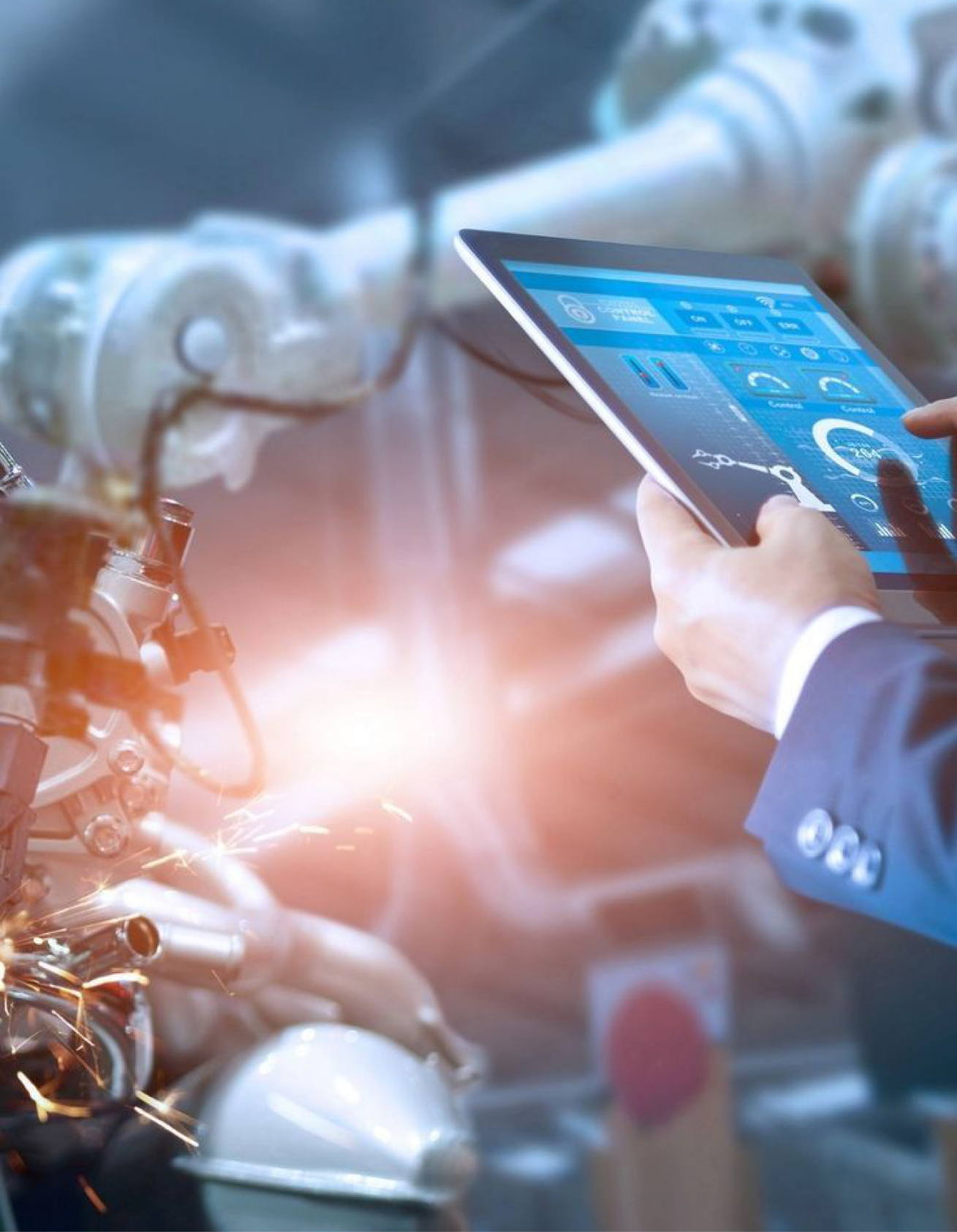 Factory worker monitoring production on a tablet